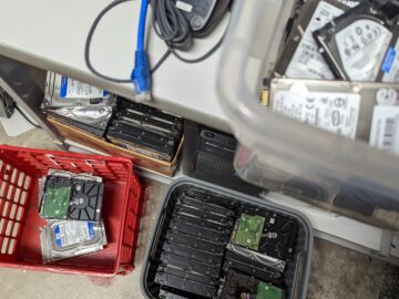 3 stacks of Hard drives waiting for destruction