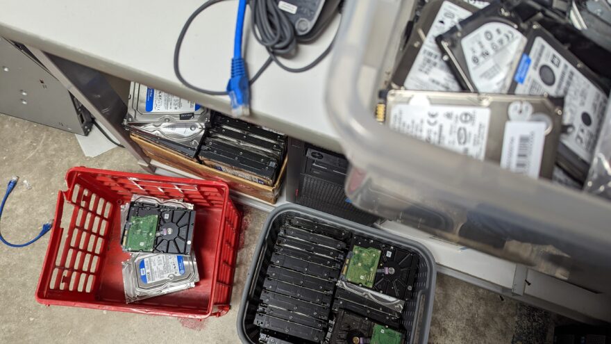 3 stacks of Hard drives waiting for destruction